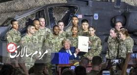 ترامپ در یک پایگاهِ نظامی دربرابرِ بالگردِ تهاجمیِ آپاچی این لایحه را امضا کرد.
